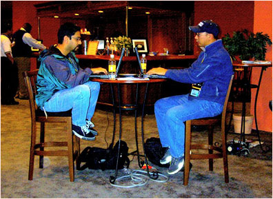 The wireless access points at Lotusphere are popular places. Nik Shenoy and Pak Sung, both with Sysinct in Toronto, set up their laptops in the Wireless Cafe just off the Product Showcase floor.
