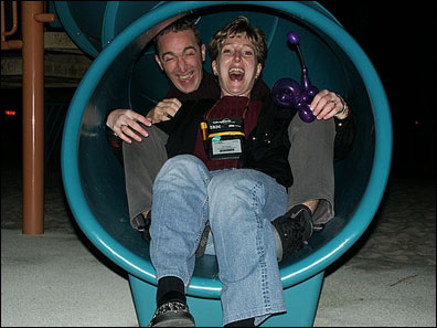 Kim Greene and friend sliding through the welcome party.