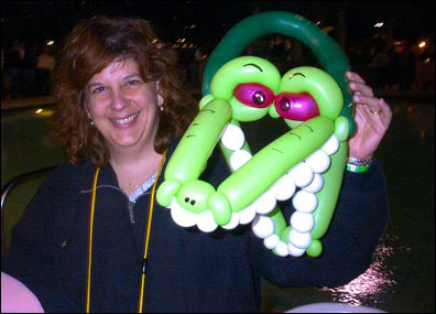 Debbie Mueller, who works at Becton Dickinson in New Jersey, shows off her Florida gator balloon hat.