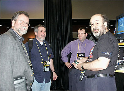 Bob Balaban, Jason Hook, and George Chiesa speak with a customer at the Dot NSF booth.