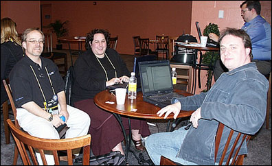Rocky Oliver and Gabriella and Tim Davis relax in the cafe and catch up on email between sessions.