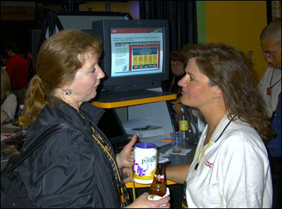 Kathleen Lynch, Boston, leader of the New England Notes User Group, chats with Terri Staton Gale, with knowledge-management vendor CSC, during the Product Showcase Reception Monday evening at Lotusphere.