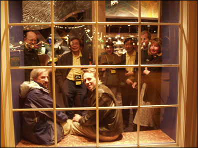 Jim Cooper, Gary Devendorf, John Grosjean, Wai Ki Yip, Julie Kadashavich, Merill Kashiwabara, George Langlais, and Sally Langlais wait for dinner at the Flying Fish.
